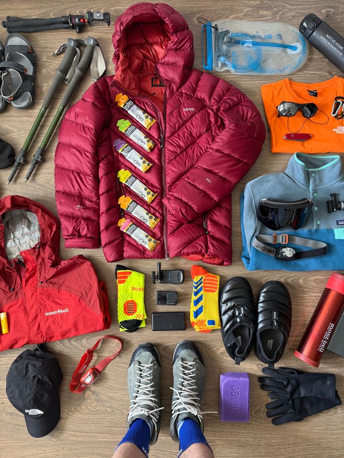 Organized flat lay of essential hiking gear for adventure and trekking.
