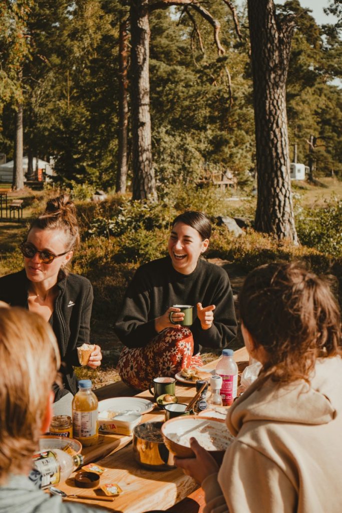woman eating and laughing together at a women's gathering
